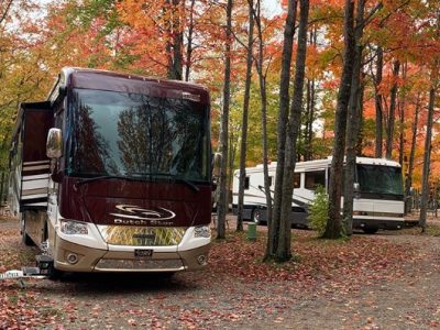 RV Camping at CreationView Campground Motorhomes parked among autumn trees at CreationView Campground in Michigan’s Irish Hills